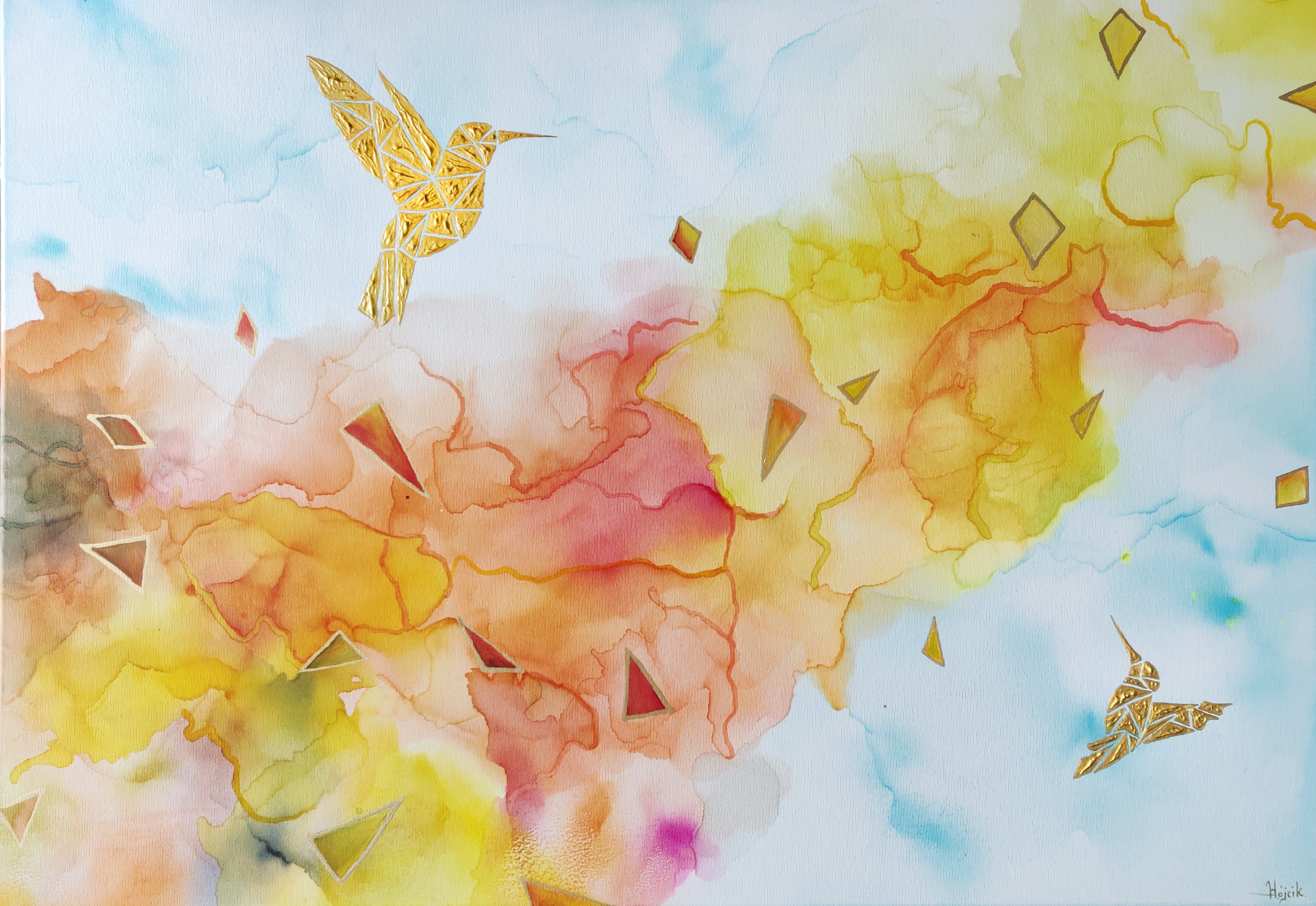 Złote kolibry w ciepłych barwach